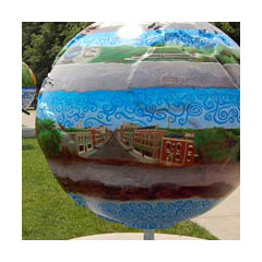 a six-foot globe set in parkland painted with colorful scenes